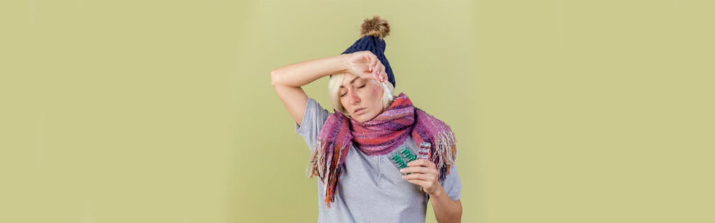 Woman with fever symptoms, seeking Express ER near me for heat-related emergency